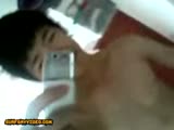 Cute asian teen jerks in front of the mirror